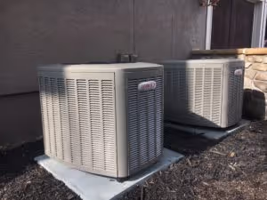 Two gray water heaters with red labels.