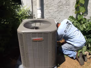 Two gray water heaters with red labels.