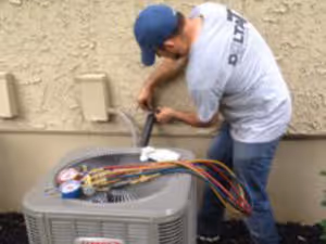 Two gray water heaters with red labels.