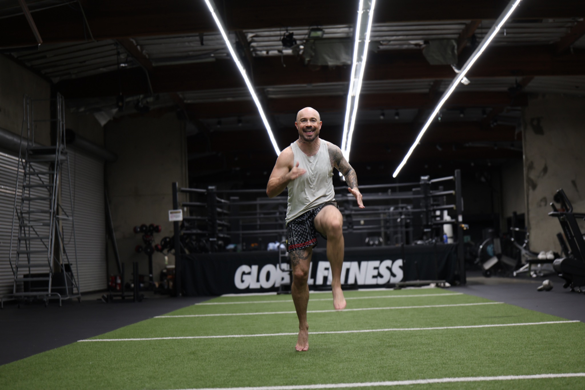 Coach Aaron demonstrating a dynamic warm-up