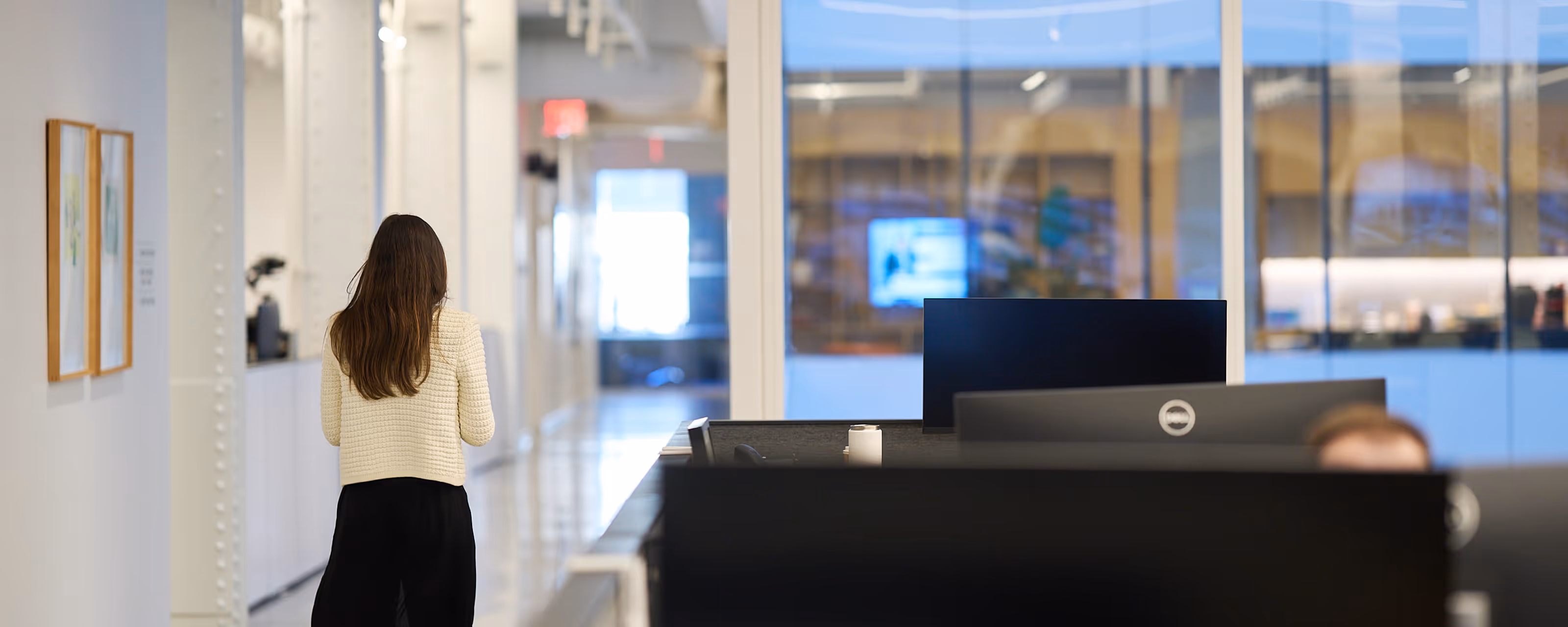 Woman walking through an office building