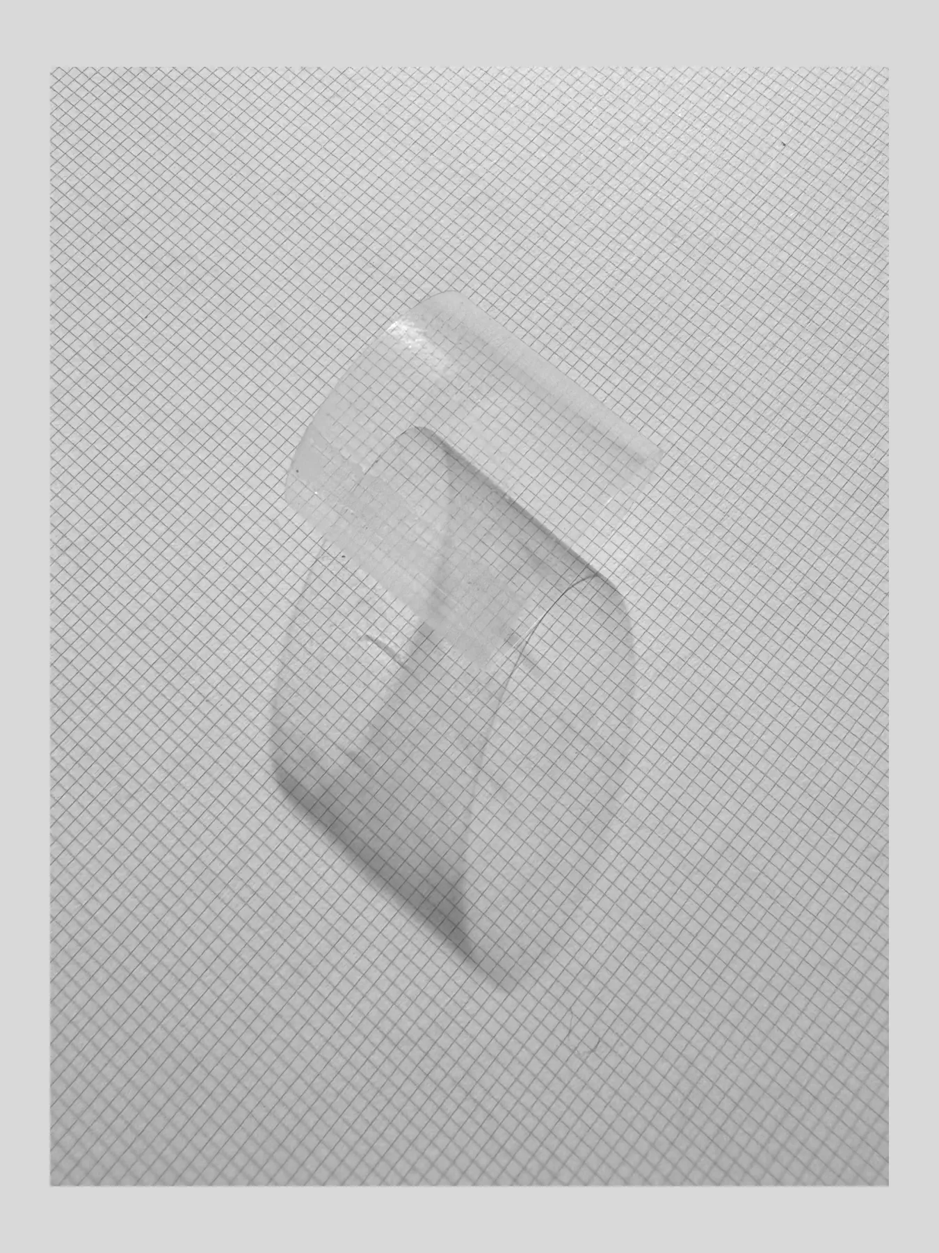 Translucent folded sheet on a white embossed background