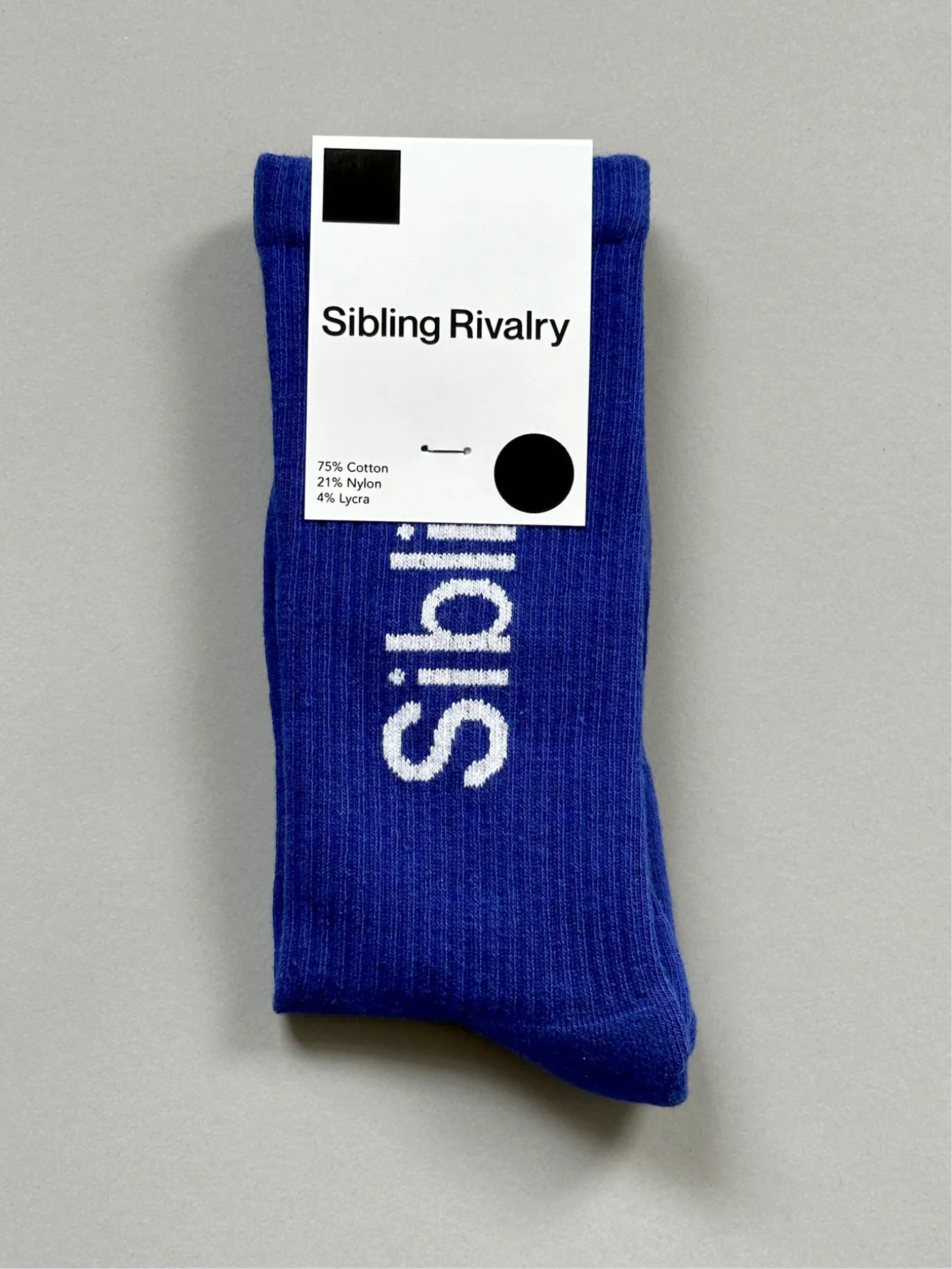 Blue Sibling Rivalry socks with their label