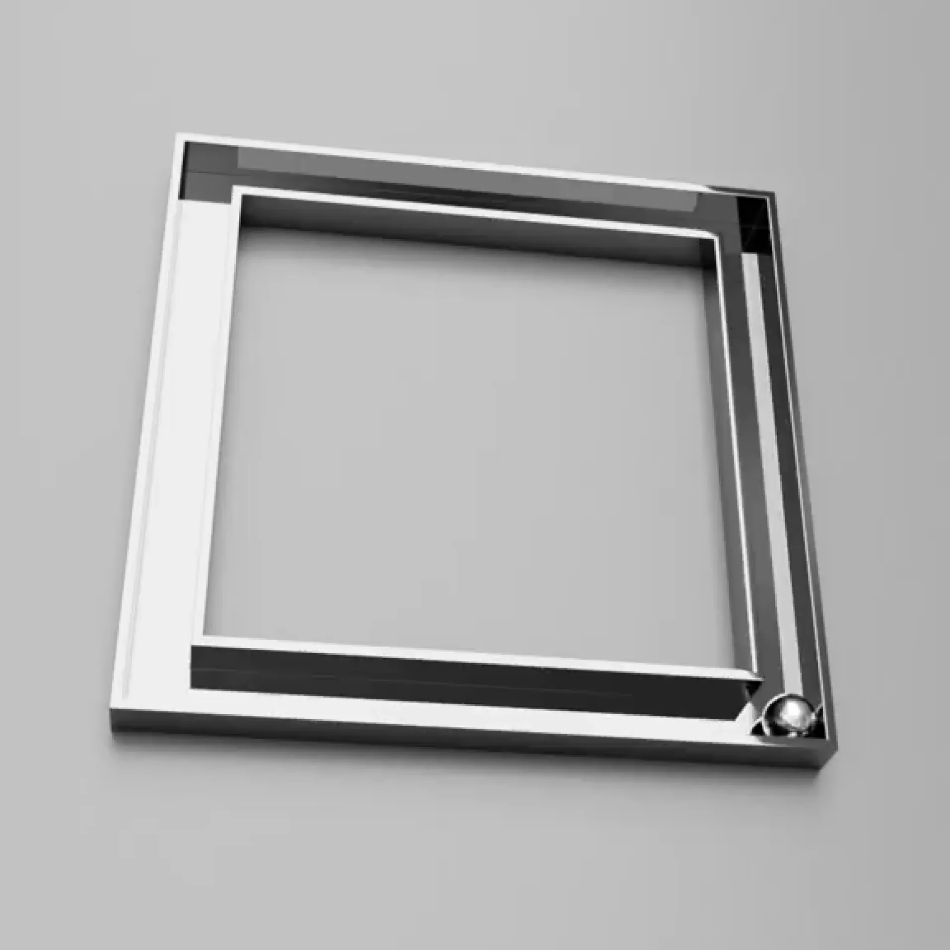 Metal square frame on a grey surface