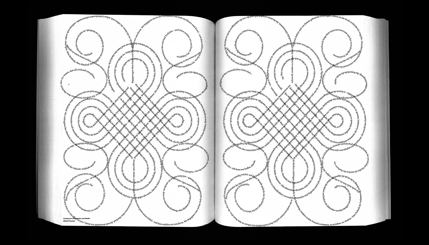 Open book with text arranged in large, diagonal V-shaped patterns across both pages on a black background, featuring German words and phrases spaced out artistically.