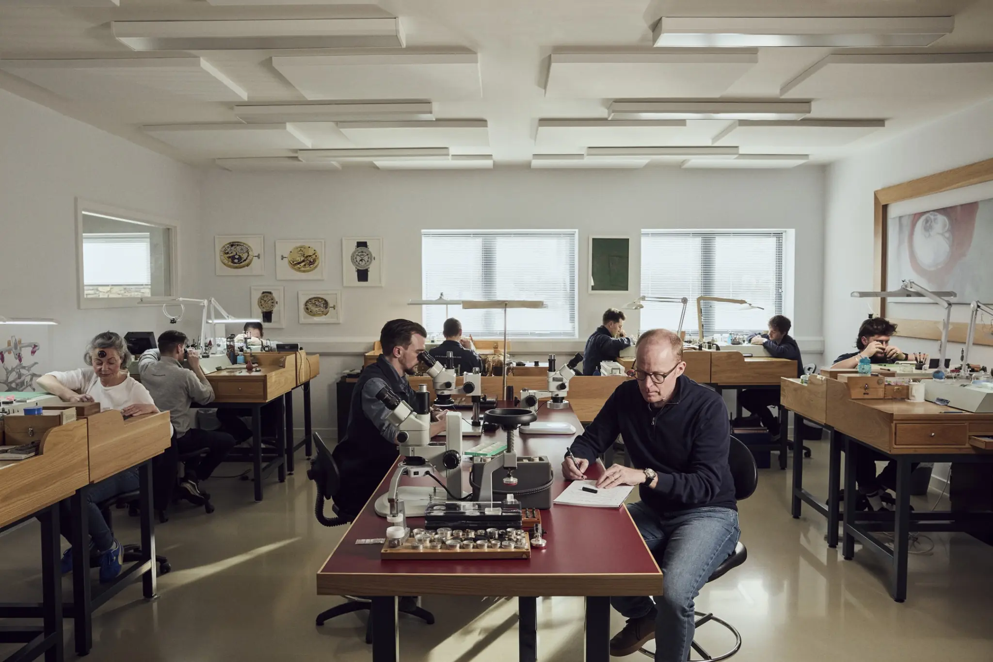 Roger W. Smith and the watchmaking team working in the Isle of Man workshop