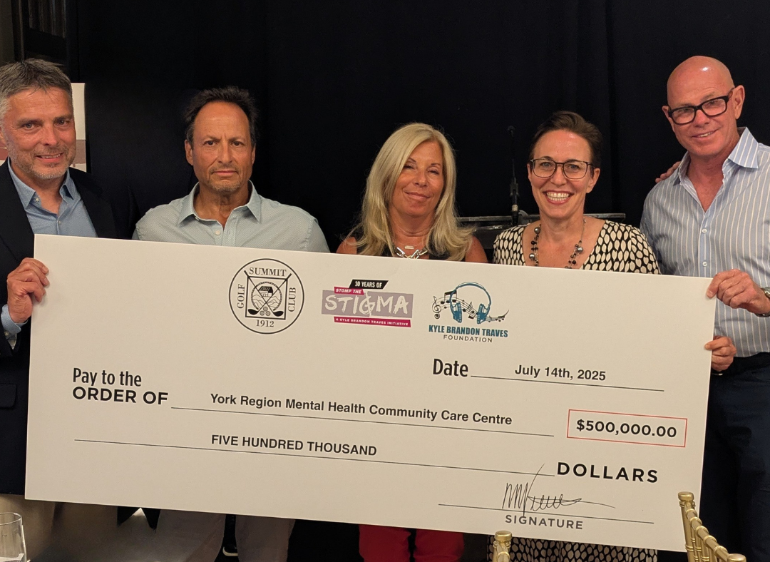5 individuals holding a cheque for $500,000