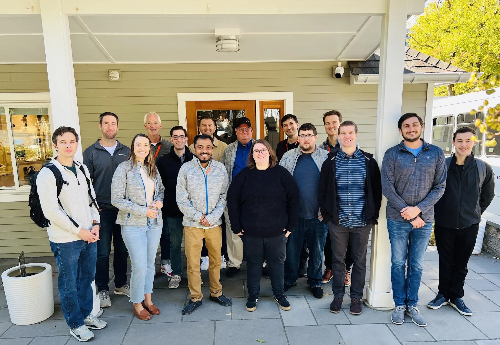 A group of Noonlight employees outside a house.
