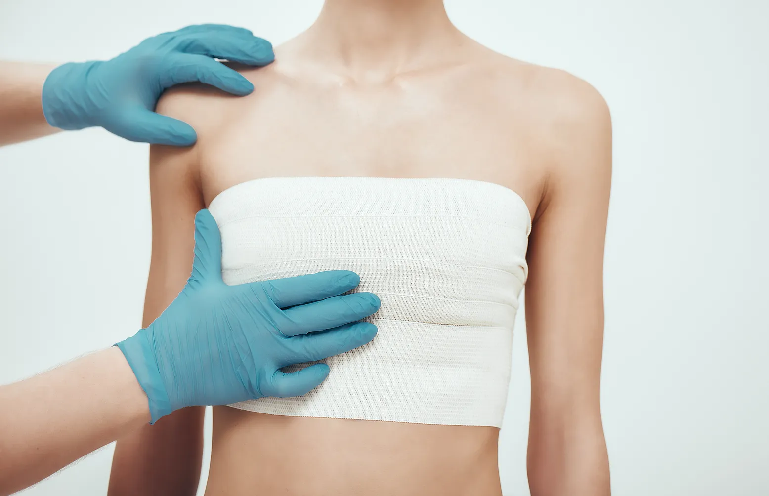 A woman with a bandage on her arm.