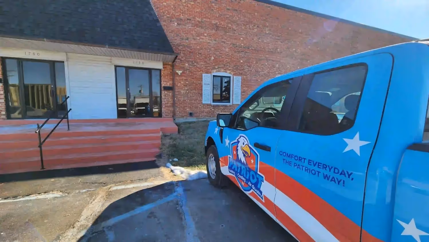 Patriot Heating, Cooling and Air Quality Truck in front of office