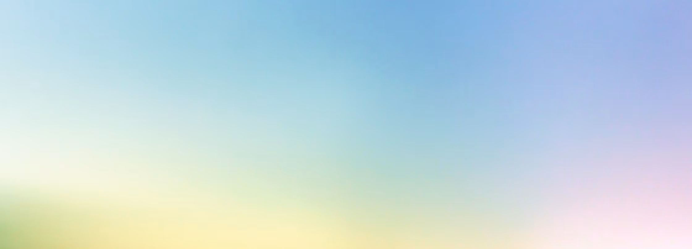 Soft gradient background blending blue, yellow, and light pink colors.