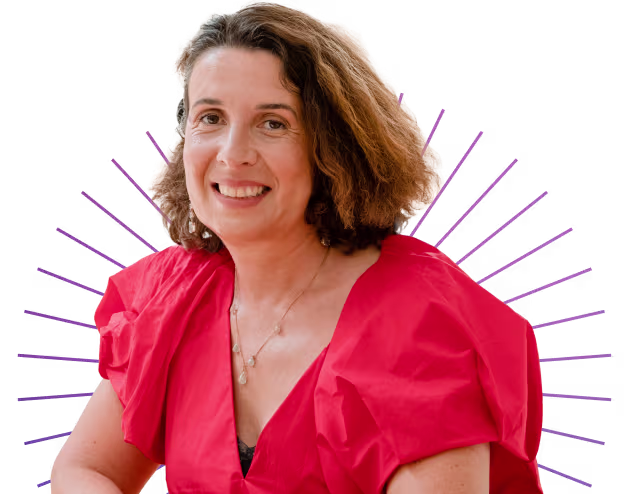 Smiling woman with shoulder-length curly hair wearing a red blouse against a transparent background.
