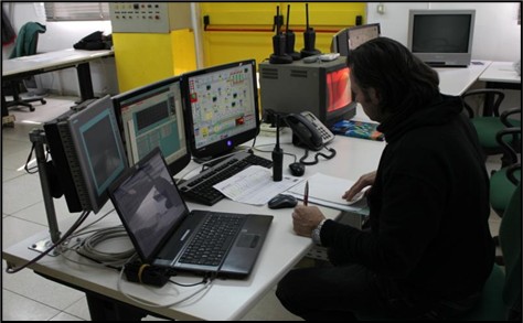 Image of an employee working in a control room for flare testing