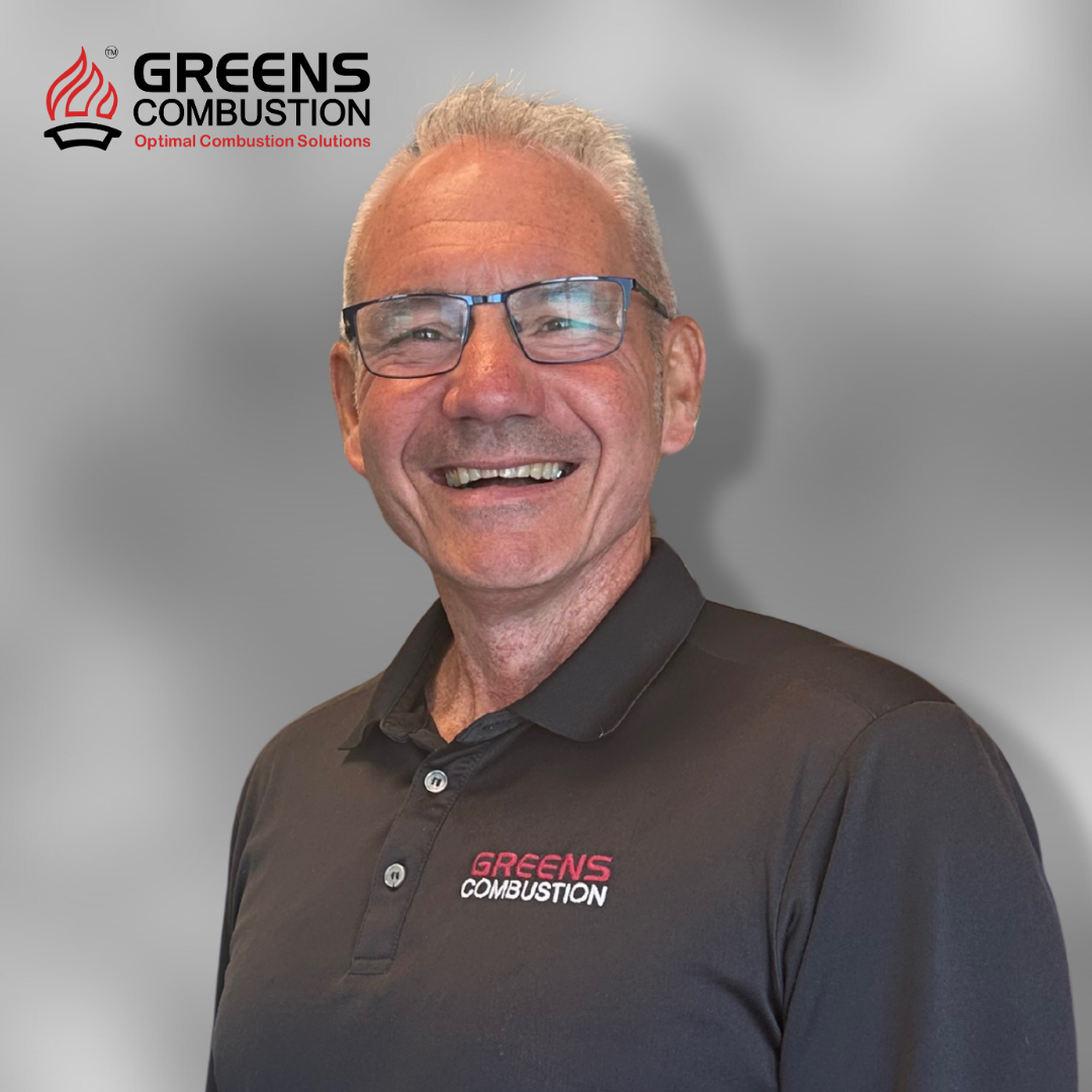 Daryl James, Director of Operations at Greens Combustion, professional portrait with company logo backdrop.