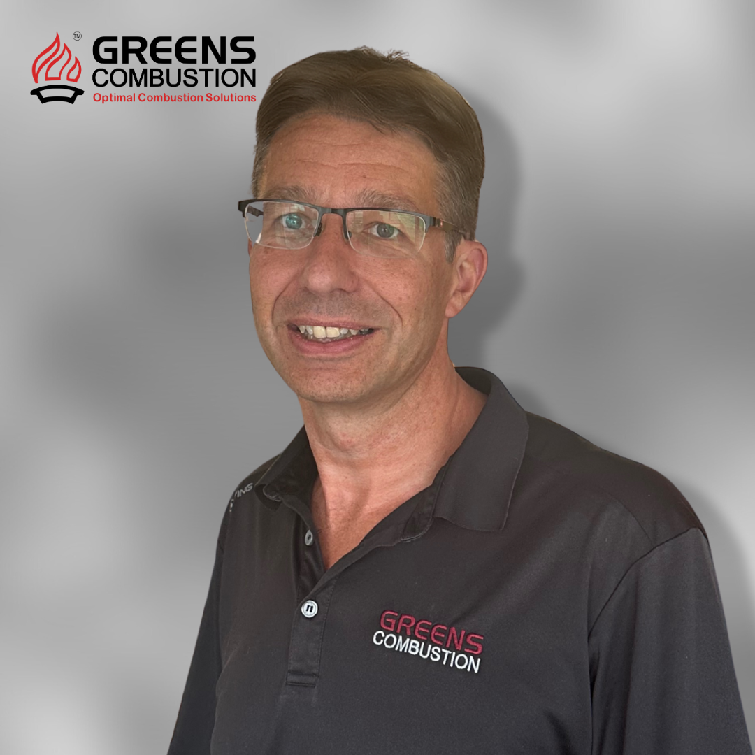 Chris Sandell, Thermal Equipment Manager at Greens Combustion, professional portrait with company logo backdrop.