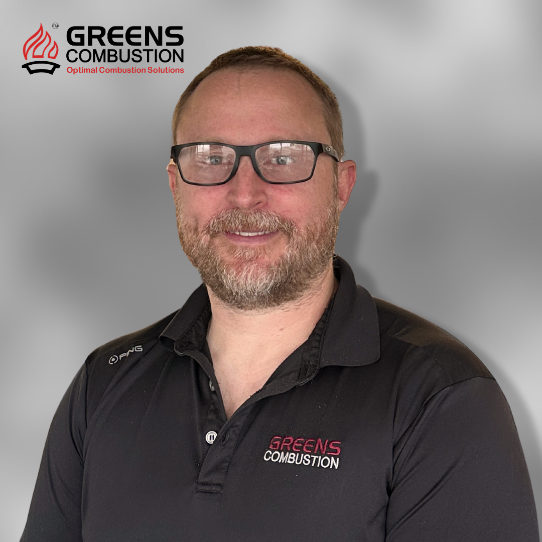 Simon Kretzschmar, Technical Manager at Greens Combustion, professional portrait with company logo backdrop.