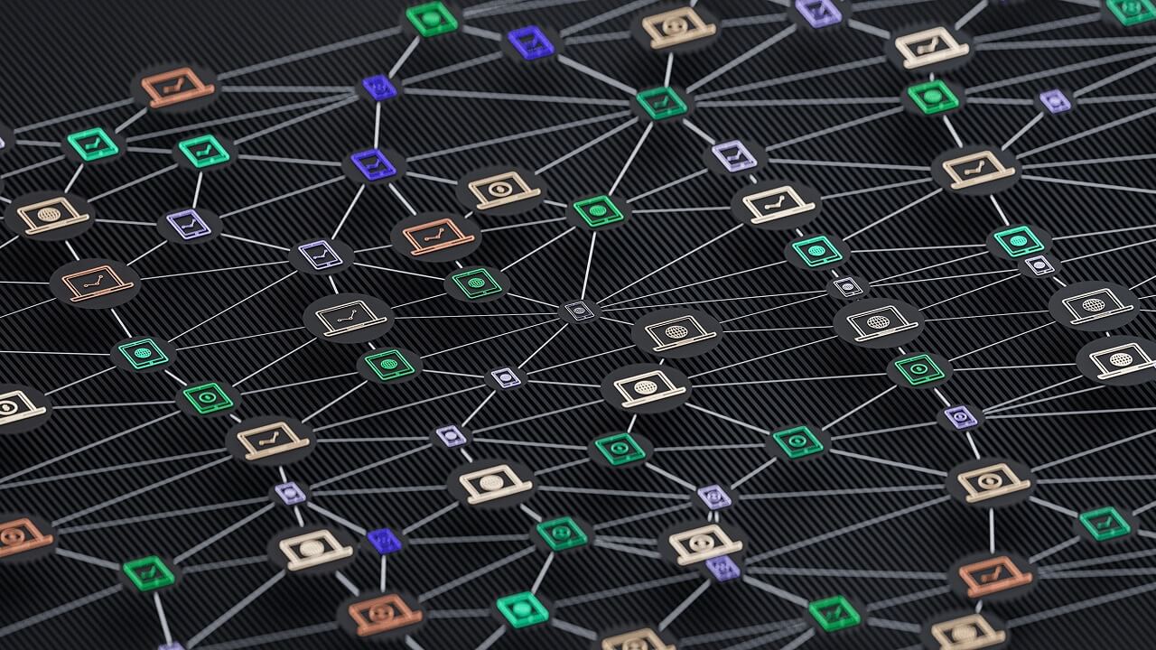 Network of interconnected colorful technology icons representing devices and data on a dark background.