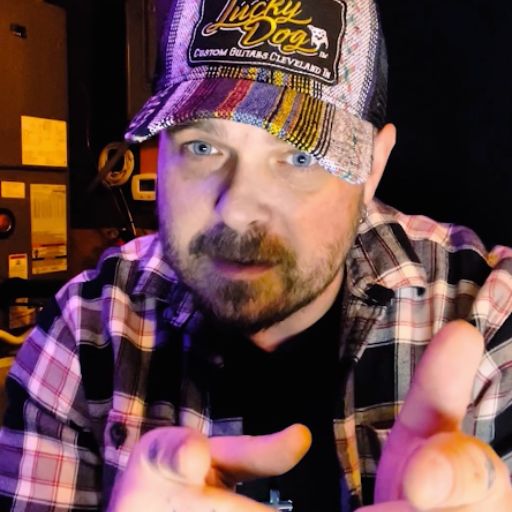 A picture of Chris Robertson producing music with the Rockin'1000