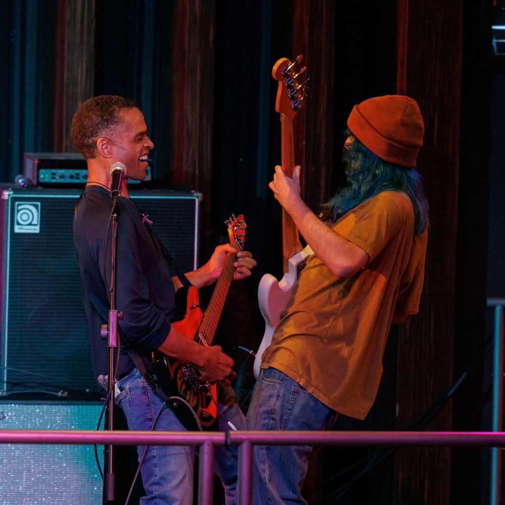 guitarists playing together