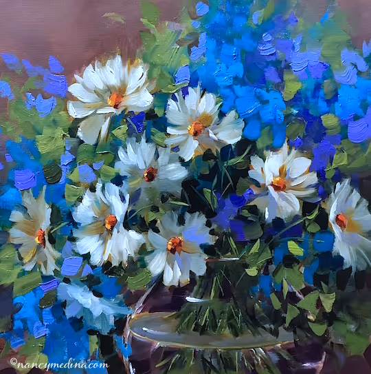  Vibrant oil painting of white daisies with golden centers in a glass vase, accented by bold blue and purple blossoms and lush green foliage, capturing the charm of a cheerful daisy painting.