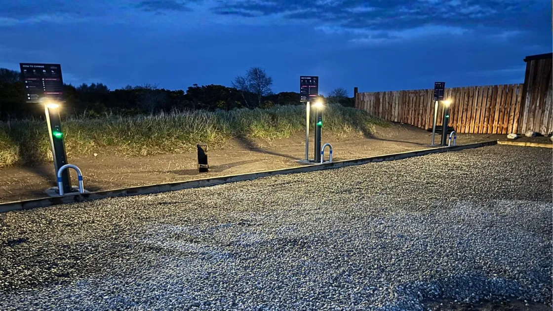 Three voltshare EV chargers with lights