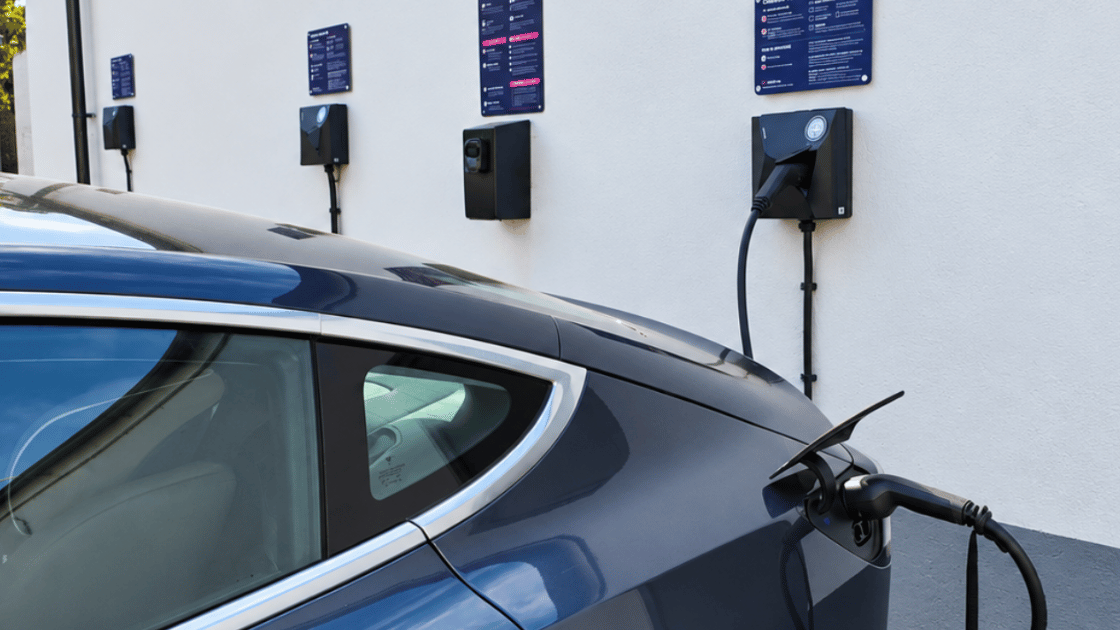 Electric vehicle plugged into an EV charger