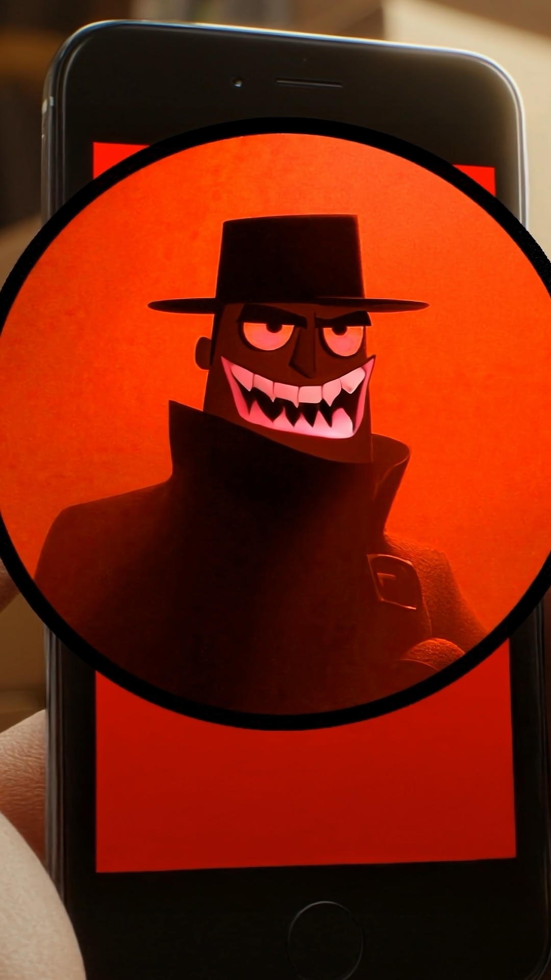 A wire fraud scammer on a cell phone