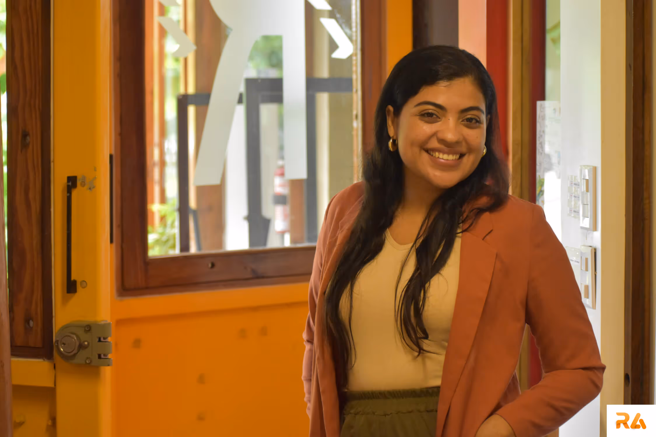 assistant of an attorney smiling and standing in a law office