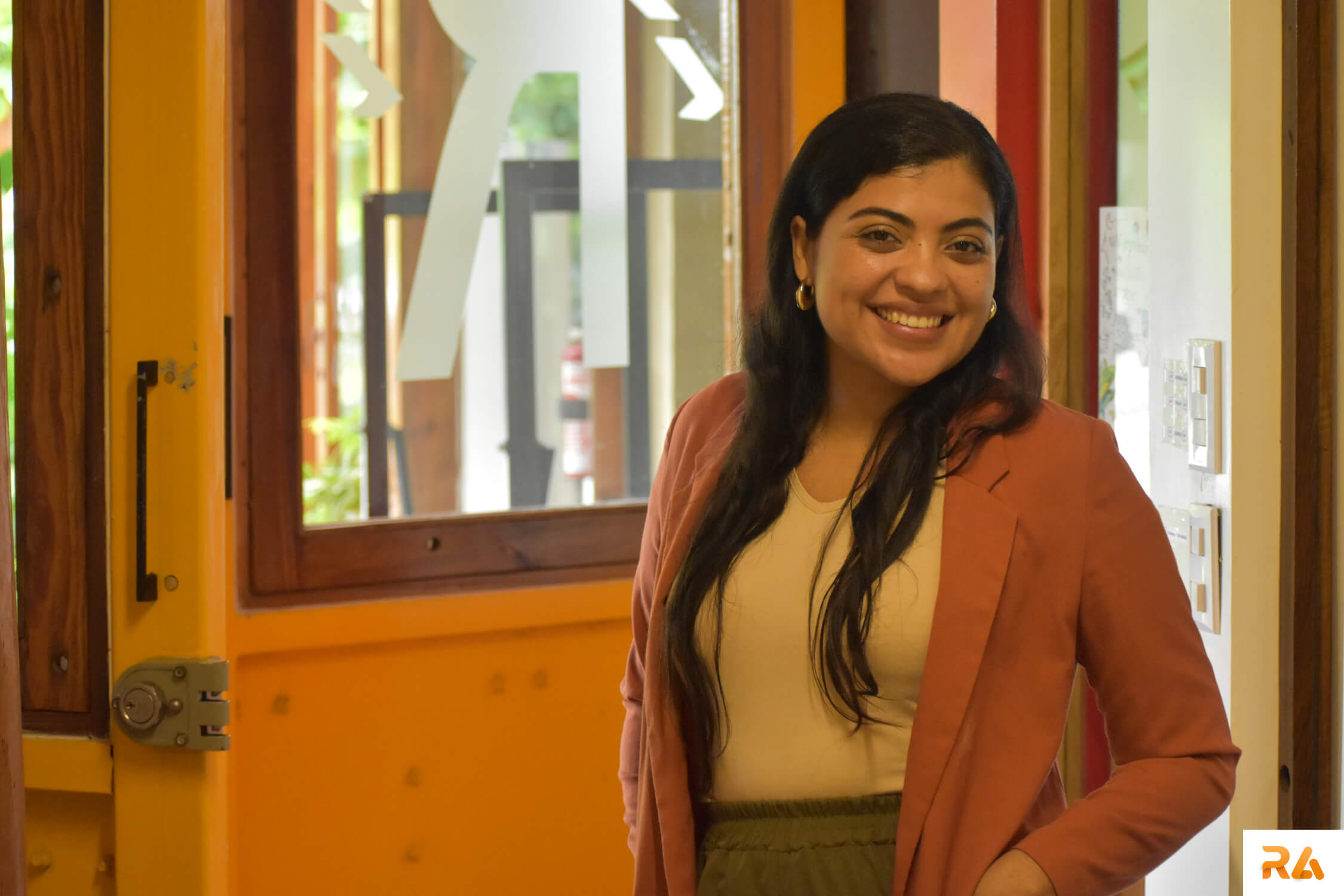 assistant of an attorney smiling and standing in a law office