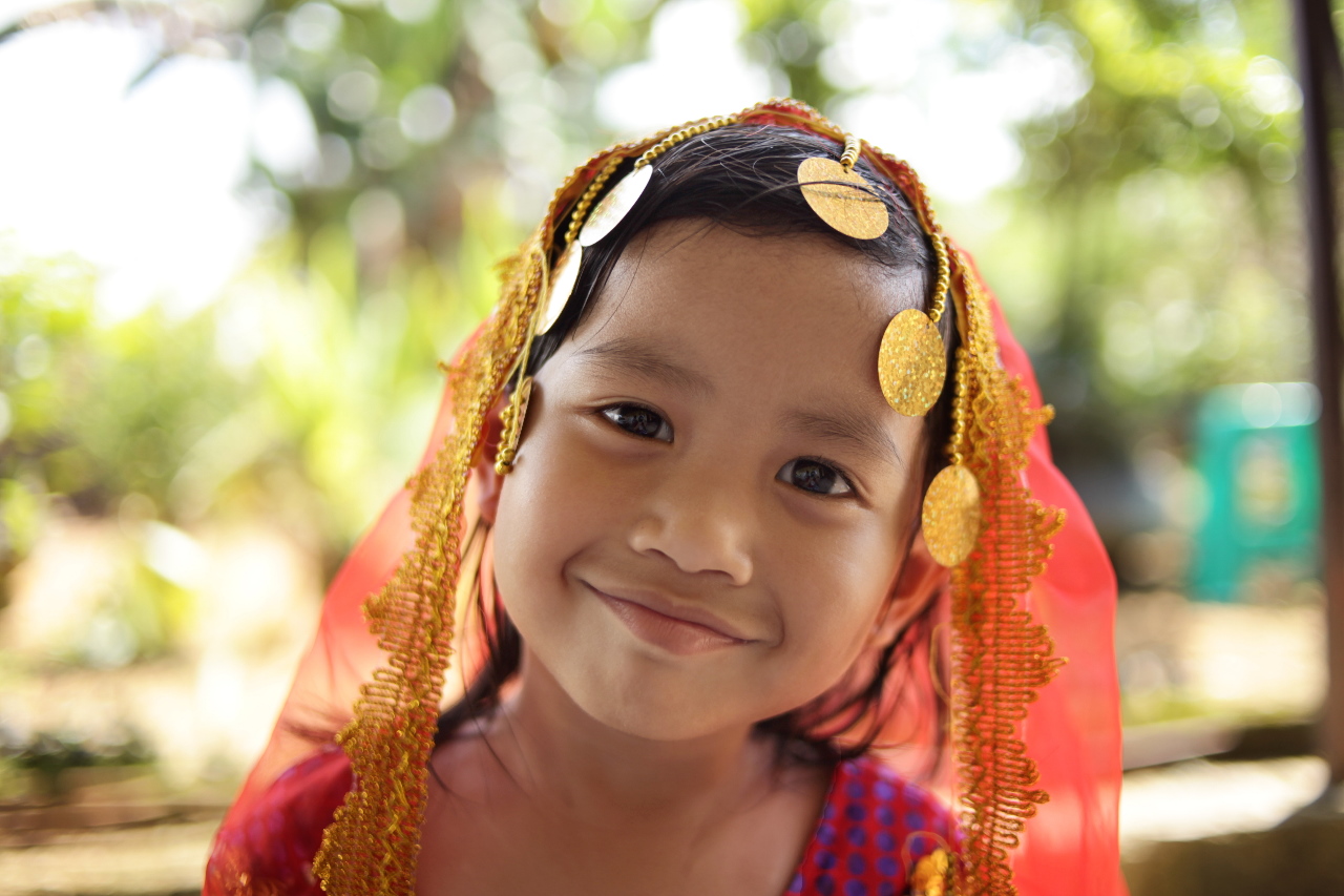 A young kid smiling for a picture