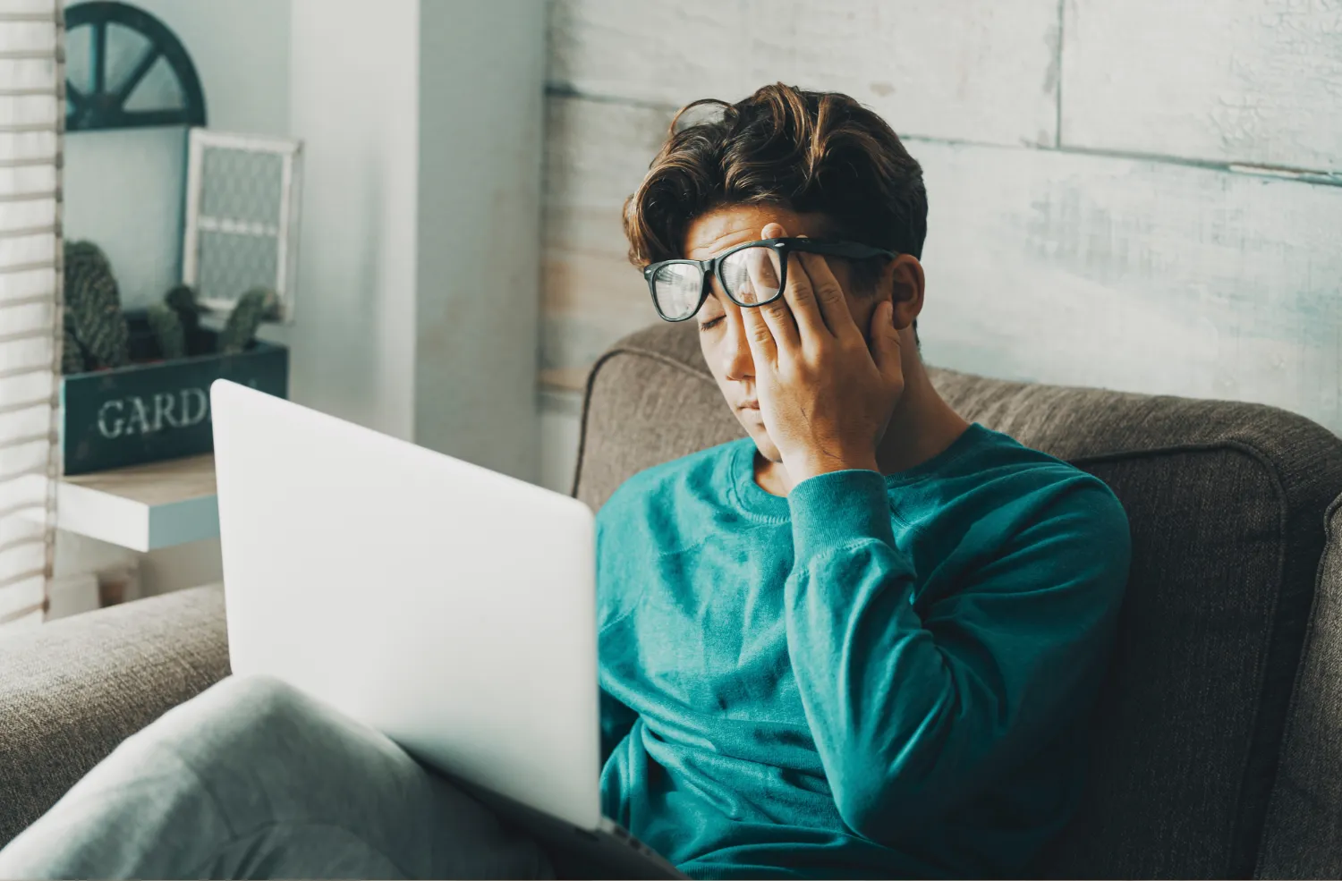 Woman at elevators in front of San Antonio Eye Specialists sign.