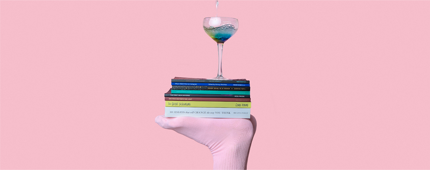 A drink placed on top of a stack of books