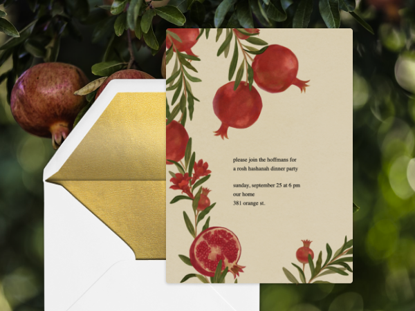 A Rosh Hashanah invitation with pomegranates and leaves.