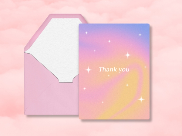 Thank you card with pastel gradient and stars next to opened pink envelope on soft pink background.
