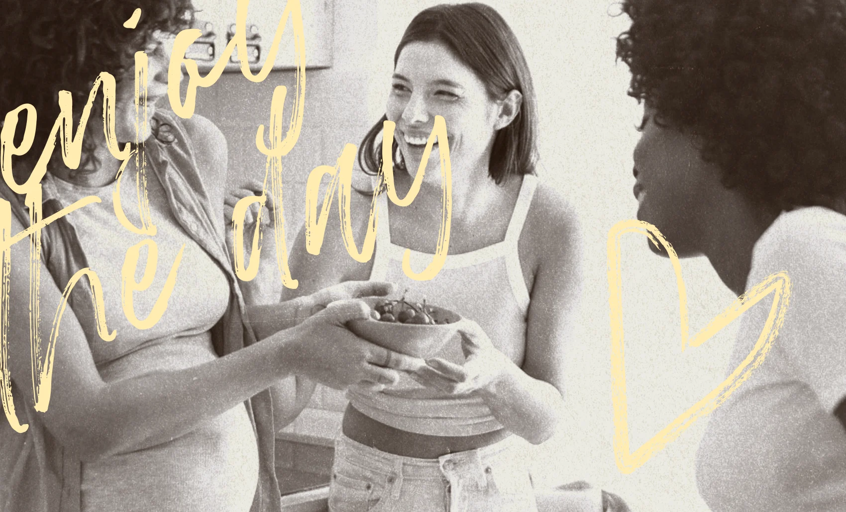 Three women sharing a bowl of cherries, smiling and enjoying each other's company.