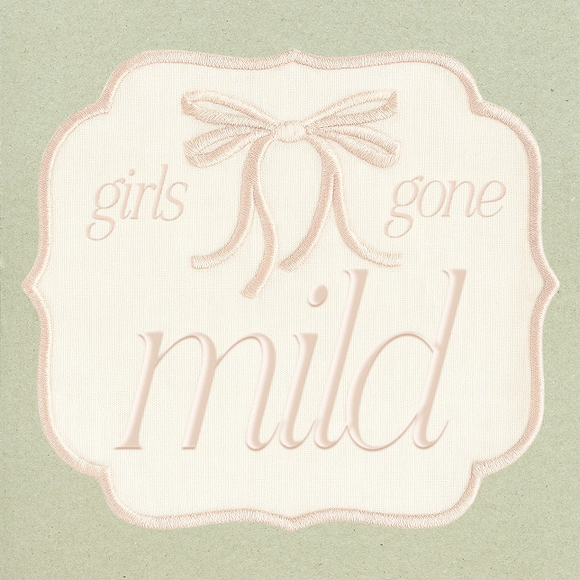 Embroidered label on fabric with words girls gone mild and a stitched bow above text.