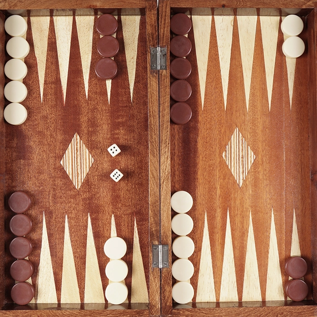 Open backgammon board with white and brown checkers and two dice showing six and five.