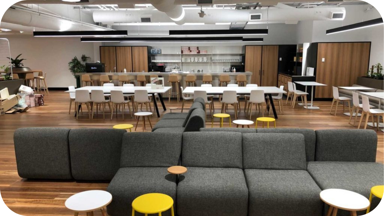 Contemporary hospitality fit out featuring open dining space, timber floors, communal seating, and a lounge area designed for relaxed gatherings.