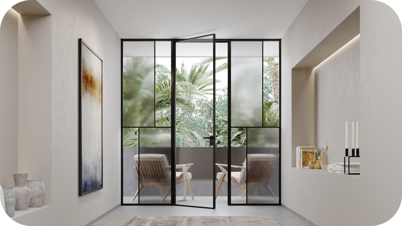 Modern interior with glass Crittall-style joinery enclosure and outdoor seating framed by black steel panels.