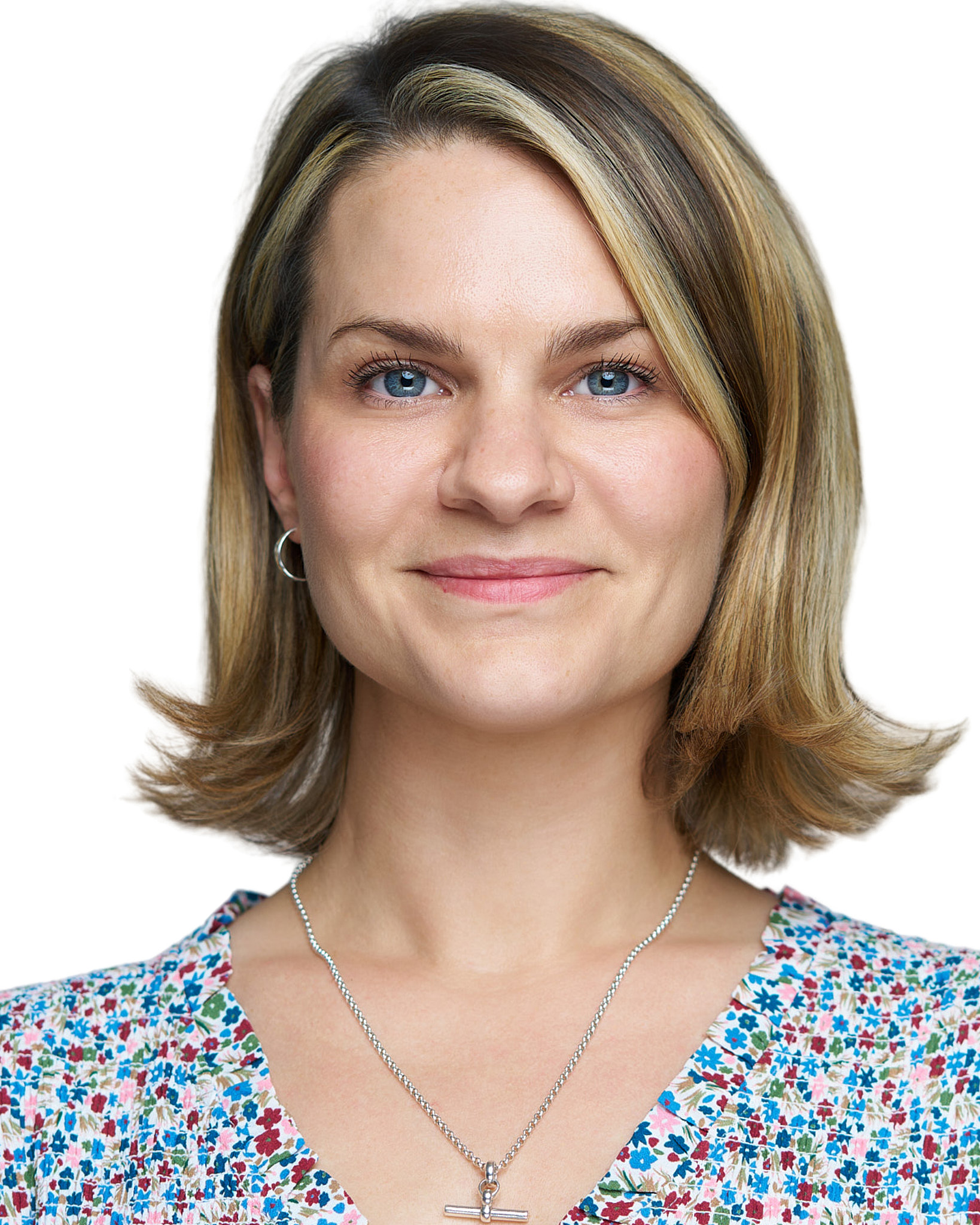 On-Location Corporate Headshots at On Site Headshots made for corporate group headshot session young woman with long blonde hair in a sleeveless black top.