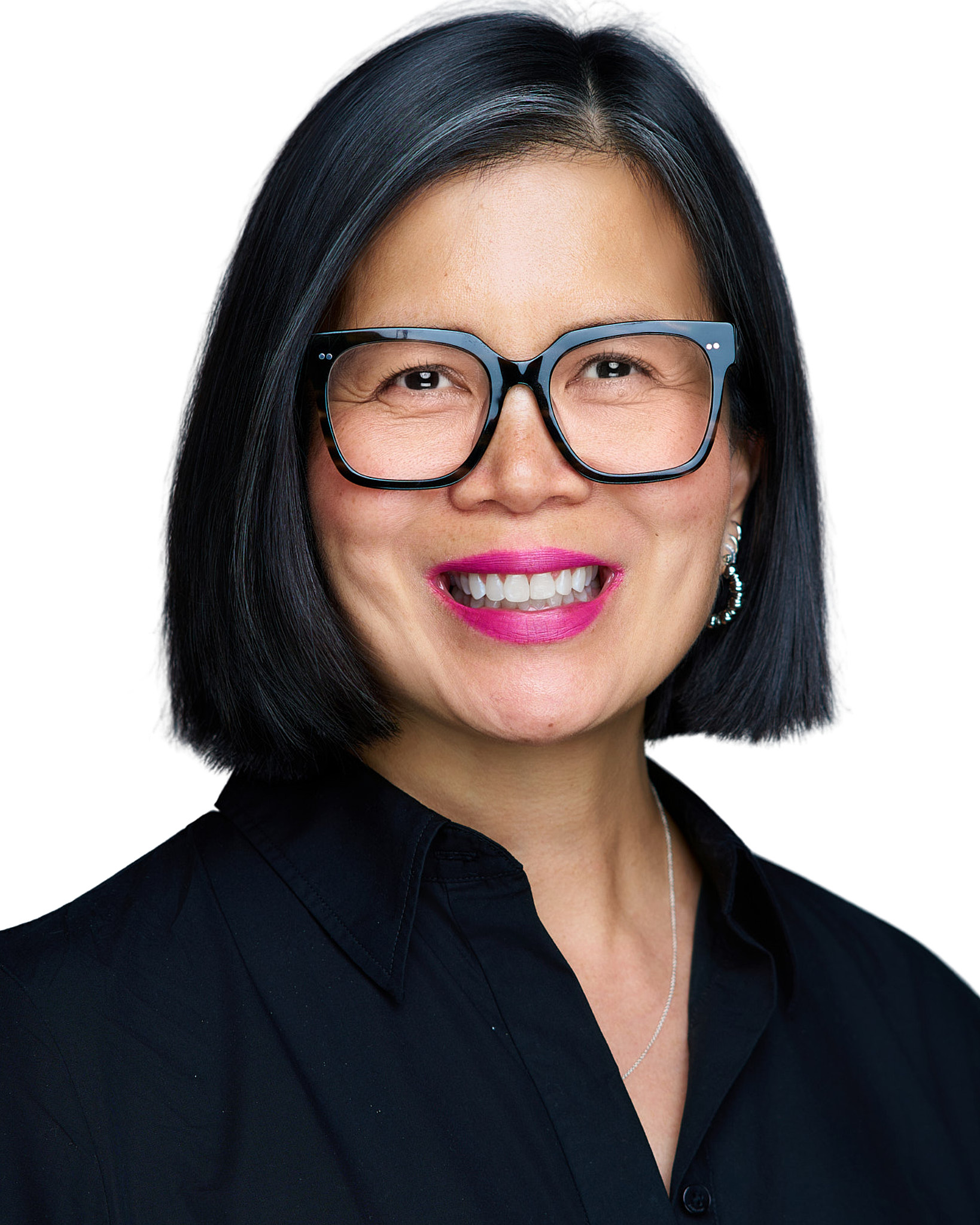 On-Location Corporate Headshots at On Site Headshots made for corporate group headshot session bald man in a blue shirt with jacket over shoulder.