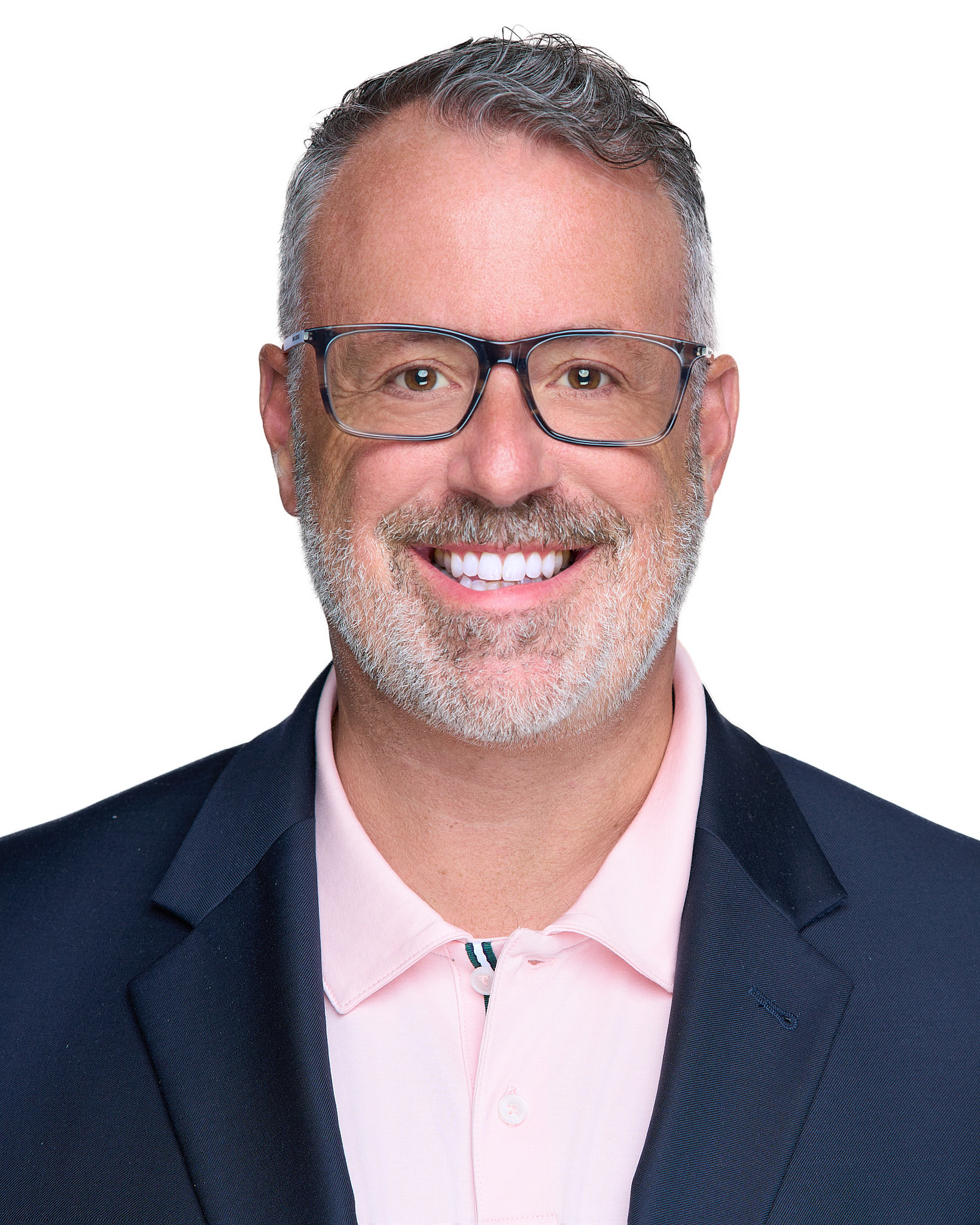 On-Location Corporate Headshots at On Site Headshots made for corporate group headshot session man with glasses and beard in a blue suit and white shirt.