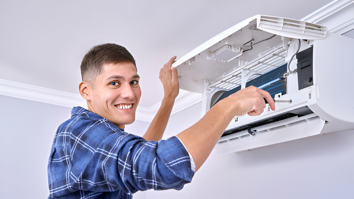 Man servicing an AC unit.