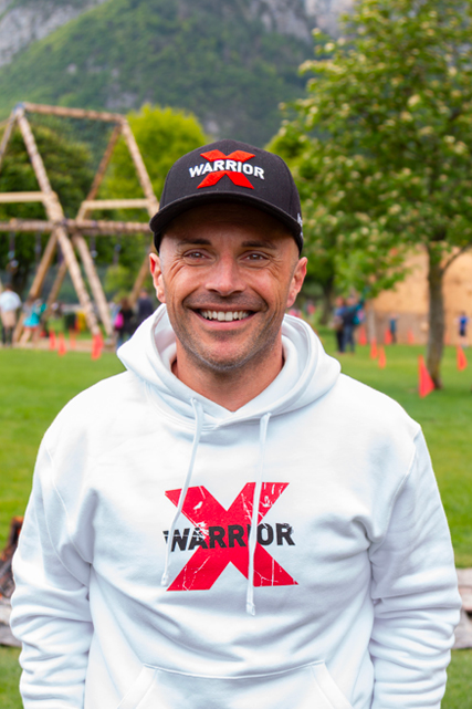 X-Warriors Speaker portrait Giacomo Petrucelli with x-warriors hoodie