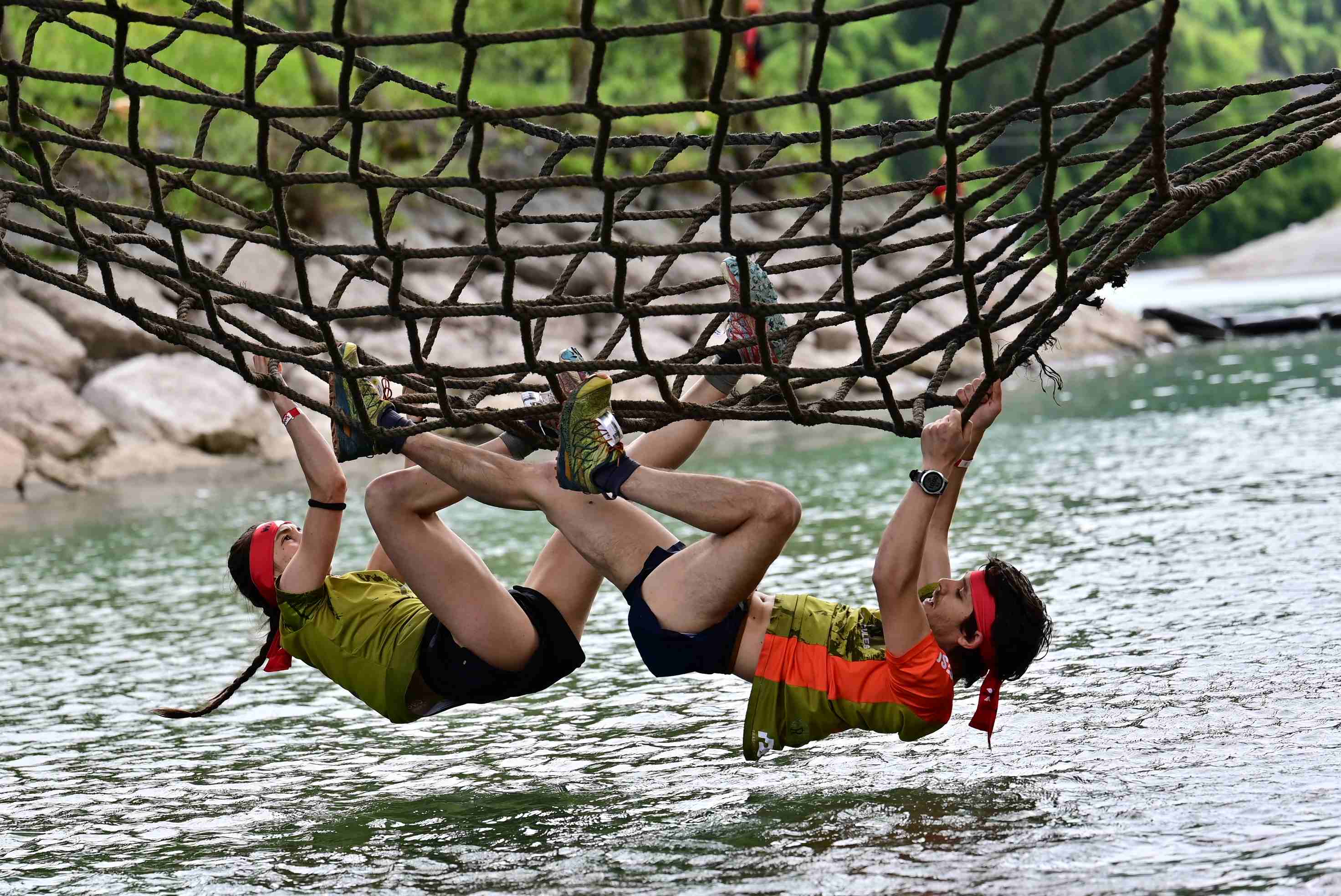 Athlete coming out of the waterfall, feeling refreshed and energized during the X Warriors race.