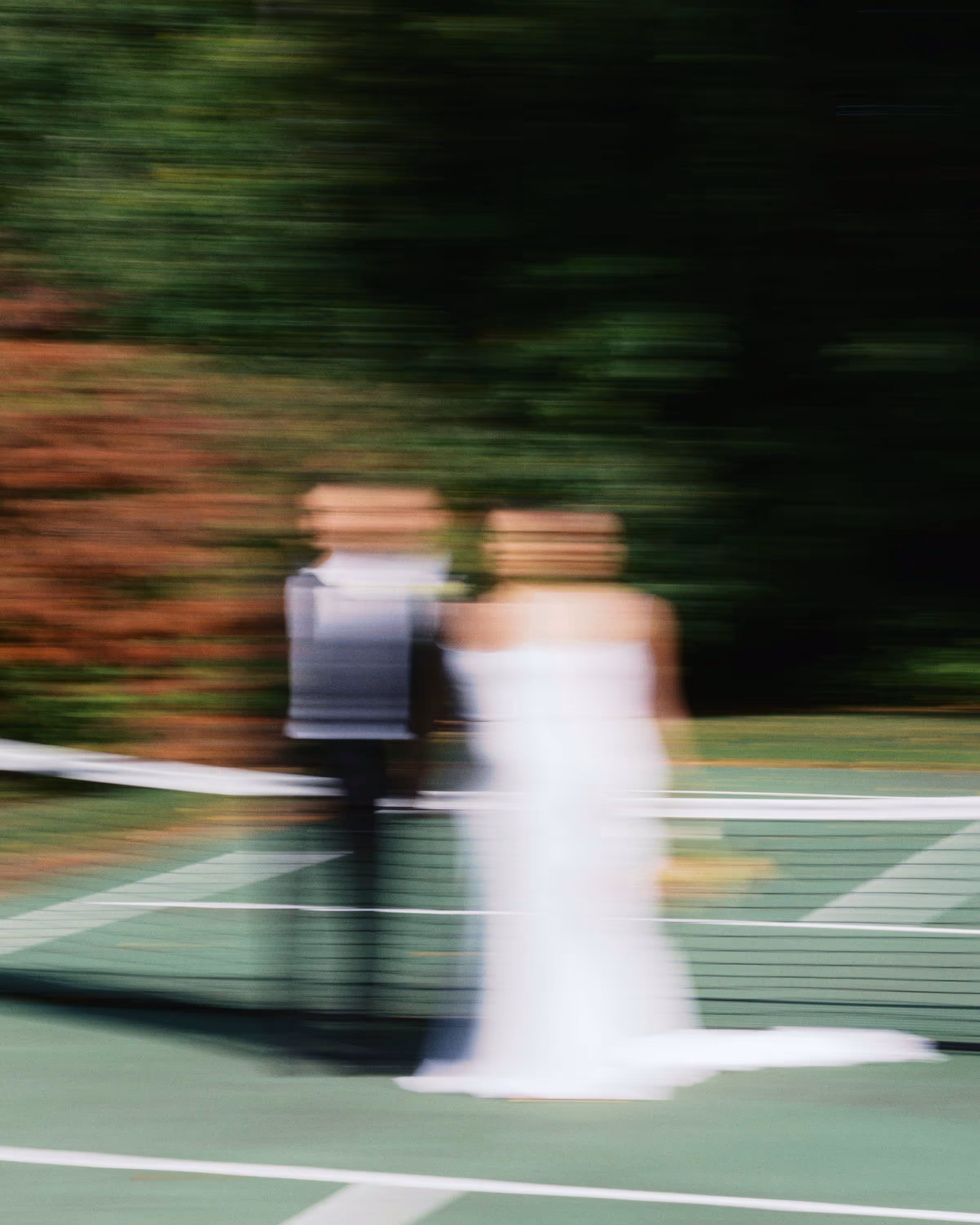 motion blur editorial documentary style couple portrait  on a tennis court during wedding Maine