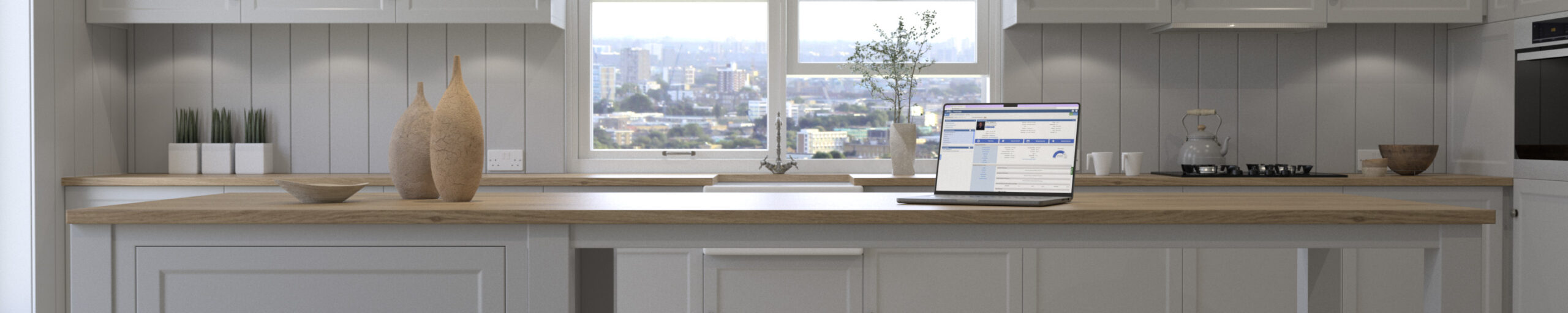 Laptop sitting on an island in a kitchen