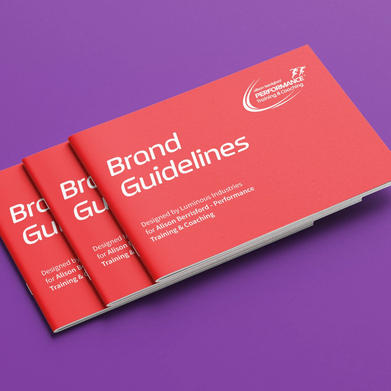 Stacked copies of the Alison Berrisford Performance Training brand guidelines, printed in coral on a purple background.