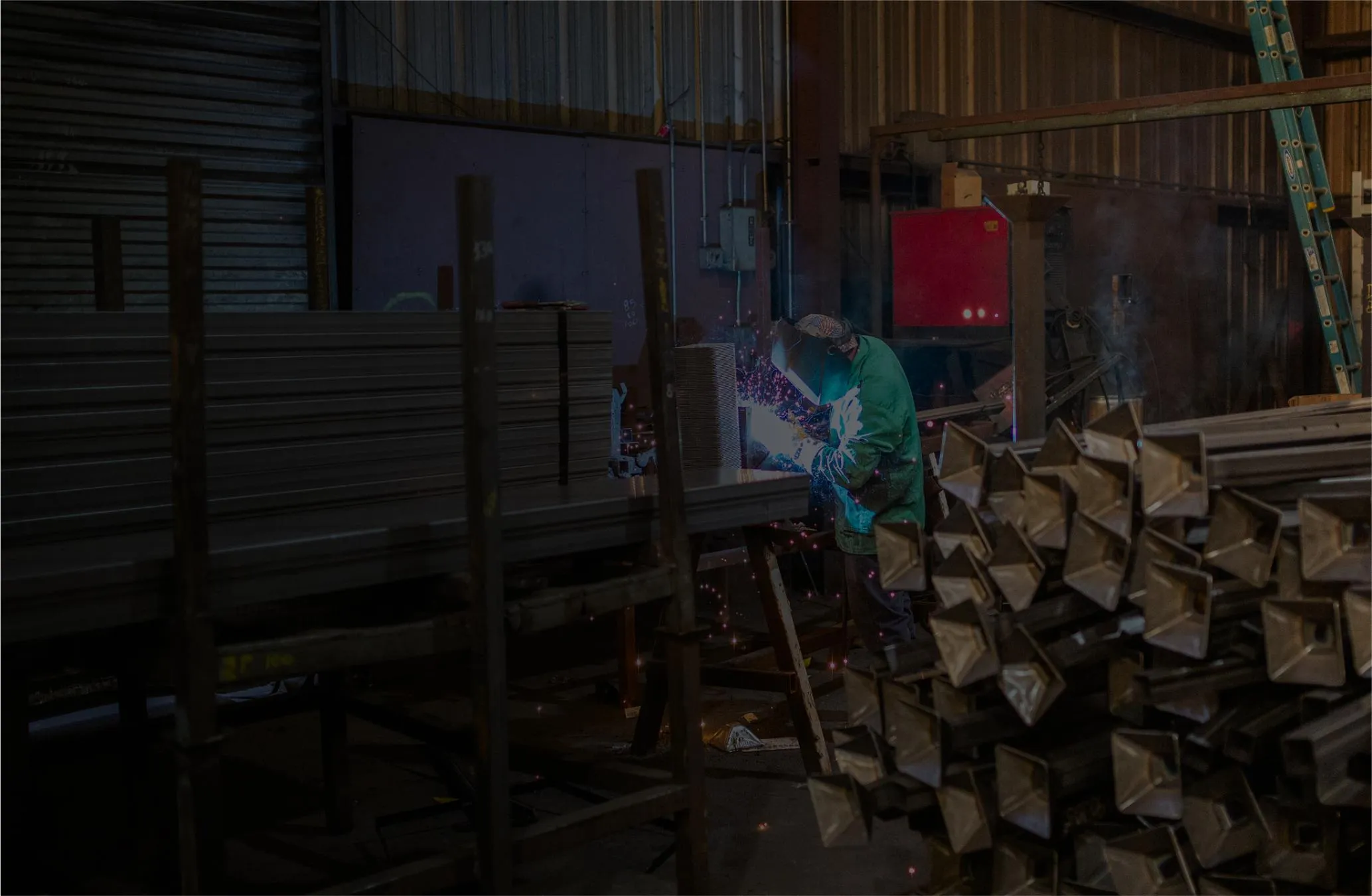 A welder welding racks