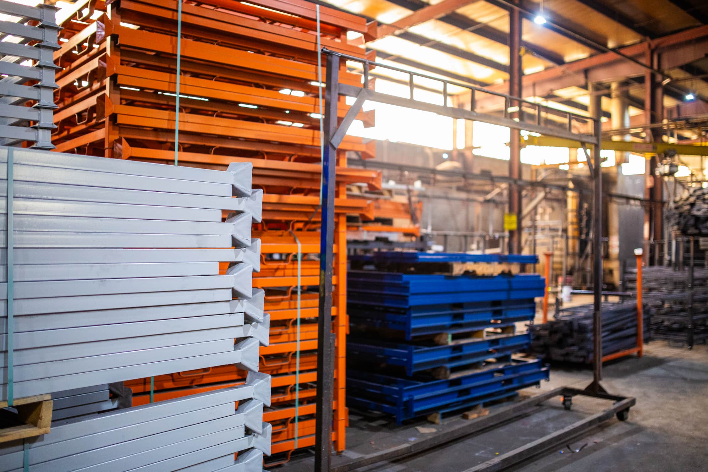 Stacking steel racks in a warehouse